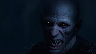 A wizened face with pointed teeth and glowing eyes snarls into the camera